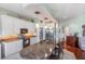 Well-appointed kitchen boasts a large island with granite countertops, stainless appliances, and a stylish design at 1536 Ember Ln, Tarpon Springs, FL 34689