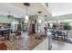 Open kitchen featuring granite counters, pendant lighting, an island with seating and stainless steel appliances at 1536 Ember Ln, Tarpon Springs, FL 34689