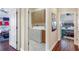Laundry room with washer and dryer between two bedrooms at 1536 Ember Ln, Tarpon Springs, FL 34689