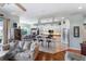 Inviting living space with hardwood floors seamlessly connected to the kitchen and dining area at 1536 Ember Ln, Tarpon Springs, FL 34689