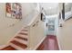 Stairway features wood stairs and floors leading up to second level at 1536 Ember Ln, Tarpon Springs, FL 34689