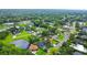 Neighborhood aerial view featuring several homes in a lush, green, and private area with ponds at 1609 Haven Bnd, Tampa, FL 33613