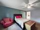 Cozy bedroom features a comfortable bed, stylish chair, and serene ambiance, creating a relaxing retreat at 1609 Haven Bnd, Tampa, FL 33613