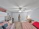 Inviting bedroom with two beds, ample storage, and a ceiling fan for comfort at 1609 Haven Bnd, Tampa, FL 33613