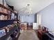 This hallway features a chandelier, hardwood floors, and built-in shelving for books and decorations at 1609 Haven Bnd, Tampa, FL 33613