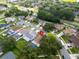 An aerial shot of a property with a fenced backyard and a sparkling private swimming pool at 1715 Larabie Ct, Brandon, FL 33511