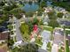 Aerial view of a charming property featuring lush greenery and a well-maintained lawn in a neighborhood setting at 1715 Larabie Ct, Brandon, FL 33511