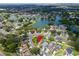 An aerial perspective of a lakeside property in a peaceful residential community setting at 1715 Larabie Ct, Brandon, FL 33511
