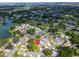 An aerial view captures a home nestled within a tranquil residential community with lake views at 1715 Larabie Ct, Brandon, FL 33511