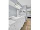 Bathroom featuring double sinks, framed mirrors, and tile flooring at 1715 Larabie Ct, Brandon, FL 33511