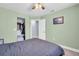 Bedroom features a closet, doorway and art filled pale green walls at 1715 Larabie Ct, Brandon, FL 33511