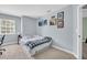 Cozy bedroom with a bed and framed art hanging on the light blue walls at 1715 Larabie Ct, Brandon, FL 33511
