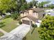 Aerial view of a two story house with a brown roof and garage at 1715 Larabie Ct, Brandon, FL 33511