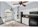 Bright kitchen featuring modern appliances, white cabinets, and an eat-in area at 1715 Larabie Ct, Brandon, FL 33511