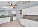 Kitchen with stainless steel appliances, white cabinets, and a breakfast bar at 1715 Larabie Ct, Brandon, FL 33511