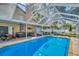 Enclosed swimming pool area with a hot tub and a picnic table at 1715 Larabie Ct, Brandon, FL 33511