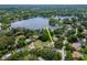 Aerial view of the property and neighborhood, showcasing its location and proximity to the water at 18004 Clear Lake Dr, Lutz, FL 33548