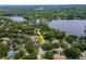 Aerial view of the property and neighborhood, showcasing its location and proximity to the water at 18004 Clear Lake Dr, Lutz, FL 33548