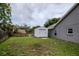Backyard shed providing additional storage space alongside the home at 18004 Clear Lake Dr, Lutz, FL 33548