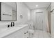 Updated bathroom with sleek vanity, modern fixtures, and tile flooring offers a clean design at 18004 Clear Lake Dr, Lutz, FL 33548