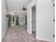Light-filled bedroom with neutral carpet and a sliding glass door to the pool at 18004 Clear Lake Dr, Lutz, FL 33548