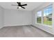 Bright and airy bedroom with neutral carpet, large windows, and ample natural light at 18004 Clear Lake Dr, Lutz, FL 33548