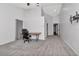 Large carpeted bedroom featuring vaulted ceiling with desk, chair, and fixtures at 18004 Clear Lake Dr, Lutz, FL 33548