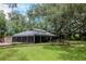 Community center with screened in porch and brick work, perfect for social gatherings and events at 18004 Clear Lake Dr, Lutz, FL 33548
