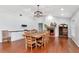 Dining area featuring hardwood floors, a large table, and built-in cabinets at 18004 Clear Lake Dr, Lutz, FL 33548