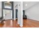 Welcoming foyer with hardwood floors, neutral paint, a striking light fixture, and an abundance of natural light at 18004 Clear Lake Dr, Lutz, FL 33548