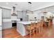 Modern kitchen featuring gray cabinets, stainless steel appliances, and a center island with seating at 18004 Clear Lake Dr, Lutz, FL 33548