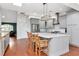Bright kitchen with an island, stainless steel appliances, custom range hood and ample counter space at 18004 Clear Lake Dr, Lutz, FL 33548