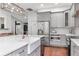Updated kitchen with white countertops, stainless steel appliances, and gray cabinetry at 18004 Clear Lake Dr, Lutz, FL 33548