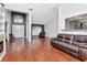 Spacious living room with hardwood floors, modern lighting, and an open concept design at 18004 Clear Lake Dr, Lutz, FL 33548