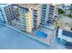 Aerial view of condo complex with pool and beach access at 18610 Gulf Blvd # 607, Indian Shores, FL 33785