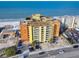 Aerial shot showcasing an oceanfront condo building near the beach with convenient parking at 18610 Gulf Blvd # 607, Indian Shores, FL 33785