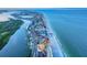 Aerial view of a beachfront condo, showcasing its prime location and proximity to the ocean and inter-coastal waterway at 18610 Gulf Blvd # 607, Indian Shores, FL 33785
