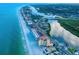 Gorgeous aerial view showcasing building near ocean, a waterway, and lush greenery in the surroundings at 18610 Gulf Blvd # 607, Indian Shores, FL 33785