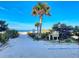 Sandy path leads to the beach, with lush greenery and a convenient access point at 18610 Gulf Blvd # 607, Indian Shores, FL 33785