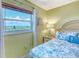 A comfortable bedroom with a great view from the window at 18610 Gulf Blvd # 607, Indian Shores, FL 33785