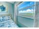 Window view overlooking the landscape and waterway provides natural light at 18610 Gulf Blvd # 607, Indian Shores, FL 33785