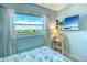 A bright bedroom with a beautiful view from the window at 18610 Gulf Blvd # 607, Indian Shores, FL 33785