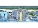 A colorful beachfront condo building with a pool and parking, offering stunning views of the waterway and ocean at 18610 Gulf Blvd # 607, Indian Shores, FL 33785
