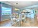 Bright dining room with a stylish table, chairs, and a stunning view at 18610 Gulf Blvd # 607, Indian Shores, FL 33785
