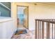 Condo entrance with a 'Welcome' mat leading to a glimpse of the unit's beach-themed decor at 18610 Gulf Blvd # 607, Indian Shores, FL 33785