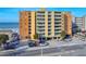 Exterior view of a high-rise condominium, showcasing architectural design and ocean proximity at 18610 Gulf Blvd # 607, Indian Shores, FL 33785