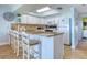 Well-equipped kitchen with granite countertops, a breakfast bar, and ample storage at 18610 Gulf Blvd # 607, Indian Shores, FL 33785