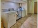 Functional laundry room with well-maintained washer and dryer units at 18610 Gulf Blvd # 607, Indian Shores, FL 33785
