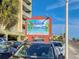 Holiday Villas III sign; condominiums with vacation rentals, and ample parking spaces at 18610 Gulf Blvd # 607, Indian Shores, FL 33785