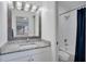 Clean bathroom with granite sink, new fixtures and a shower-tub combination at 1933 Whitney Way, Clearwater, FL 33760